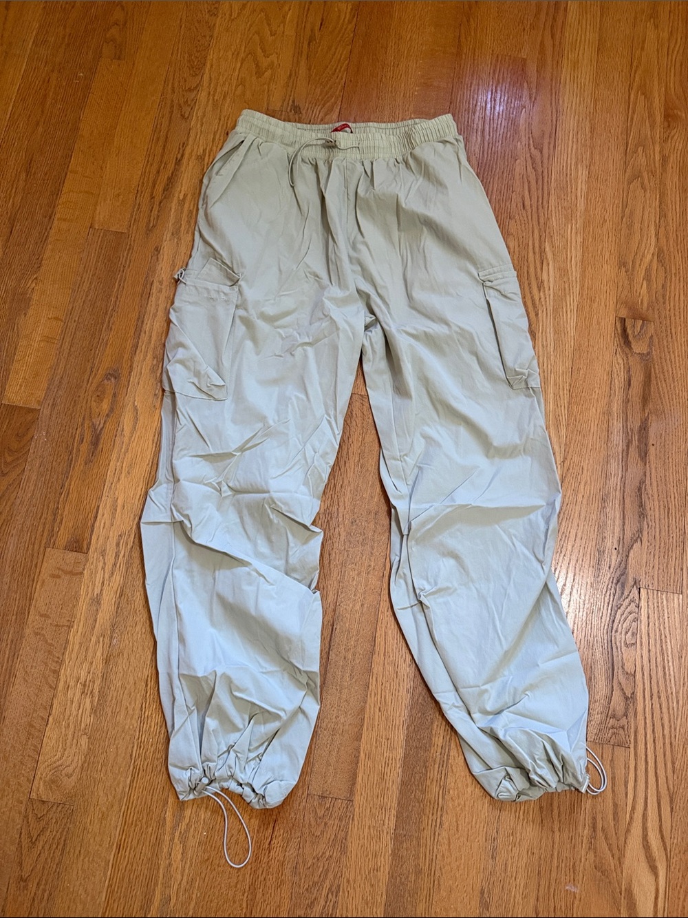 Pale green parachute pants